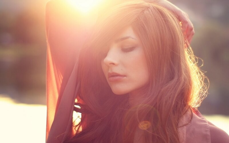 woman in sunlight with closed eyes
