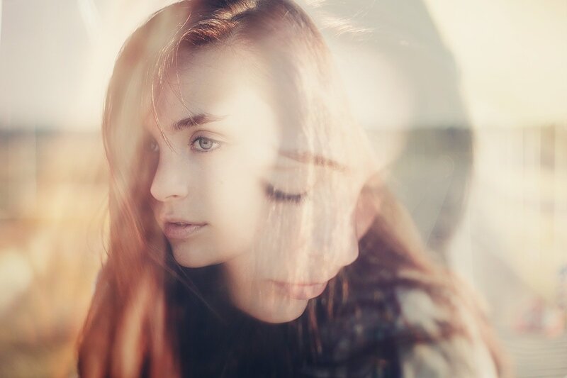 woman in sunlight with double exposure