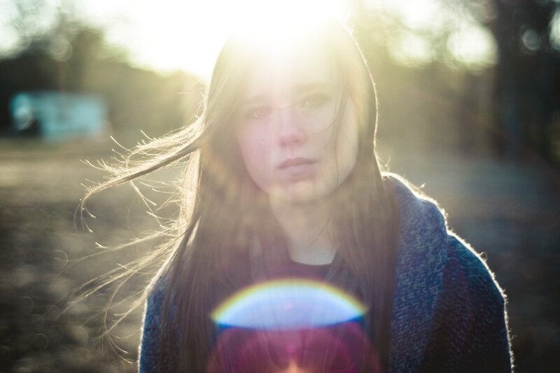 woman in sunlight with lens flare