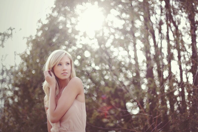 woman in sunlight with trees