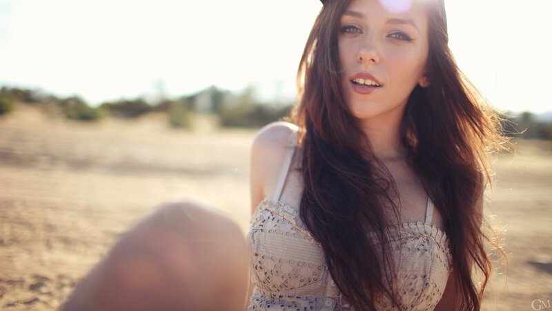 woman in sunlit field
