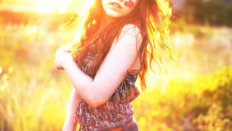 woman in sunlit field