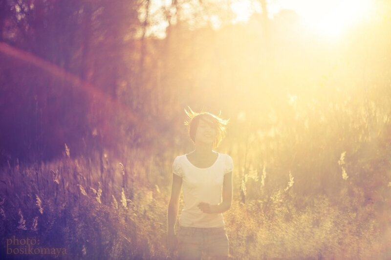 woman in sunlit field