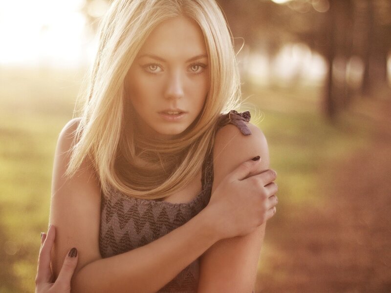 woman in sunlit field