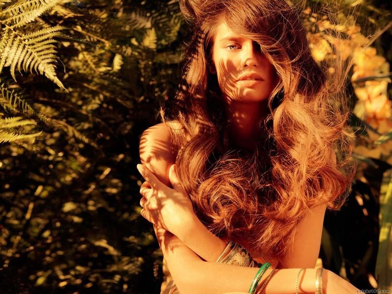 woman in sunlit foliage