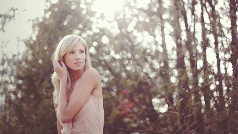 woman in sunlit forest