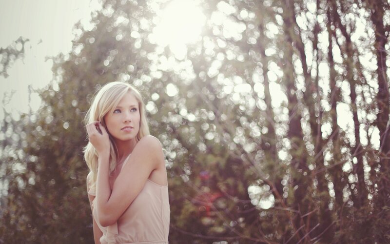 woman in sunlit forest