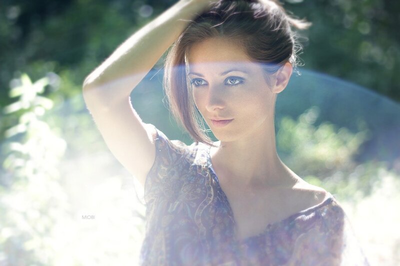 woman in sunlit garden