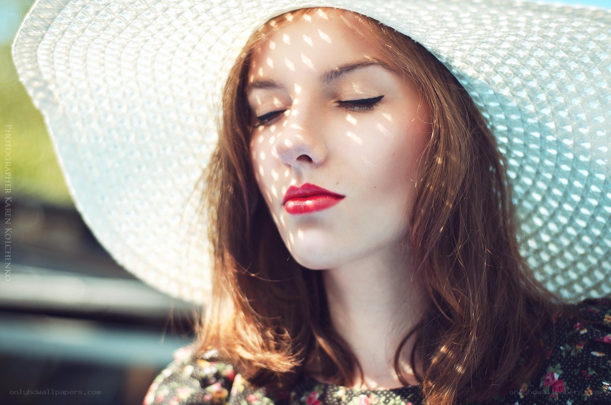 woman in sunlit hat