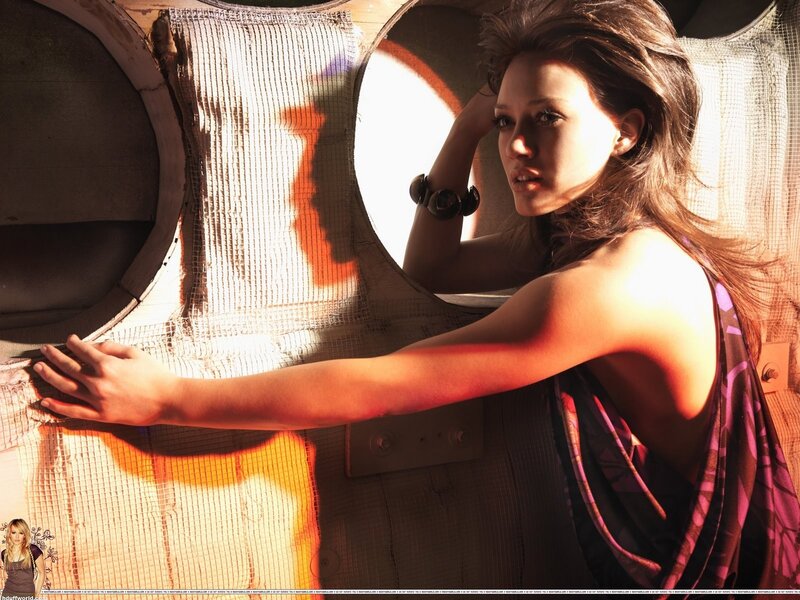 woman in sunlit industrial setting