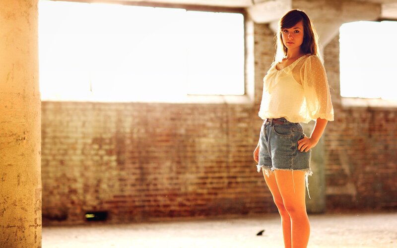 woman in sunlit warehouse
