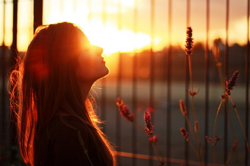 woman in sunset silhouette