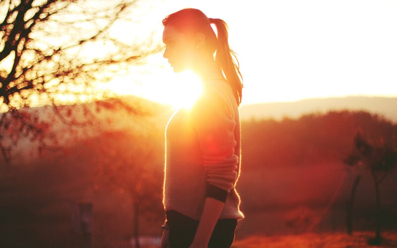 woman in sunset silhouette