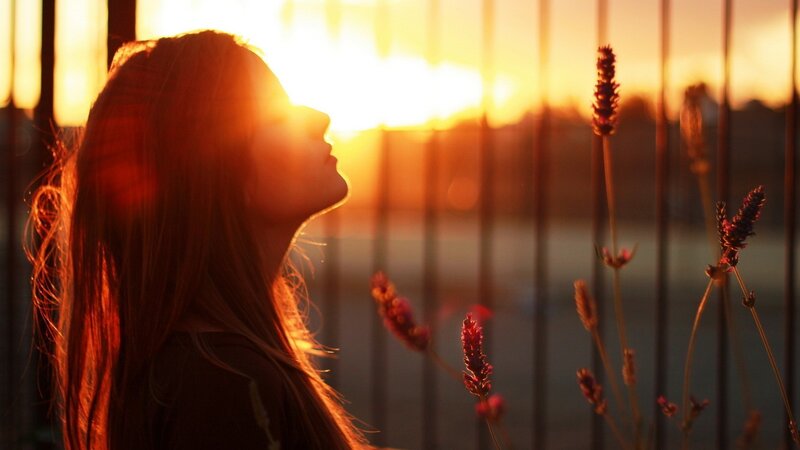 woman in sunset silhouette
