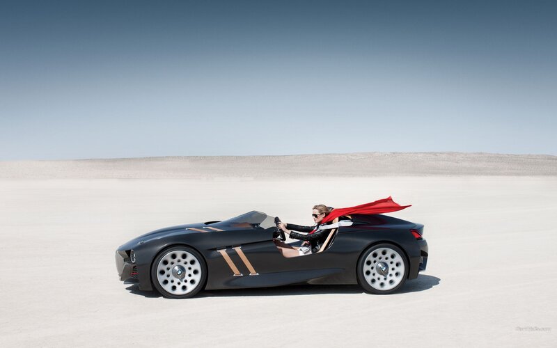 woman in supercar on desert