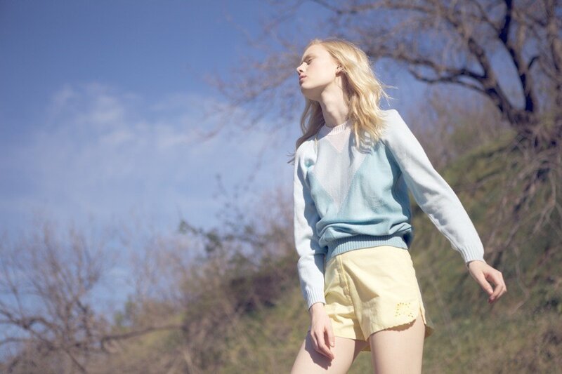 Woman in sweater and shorts