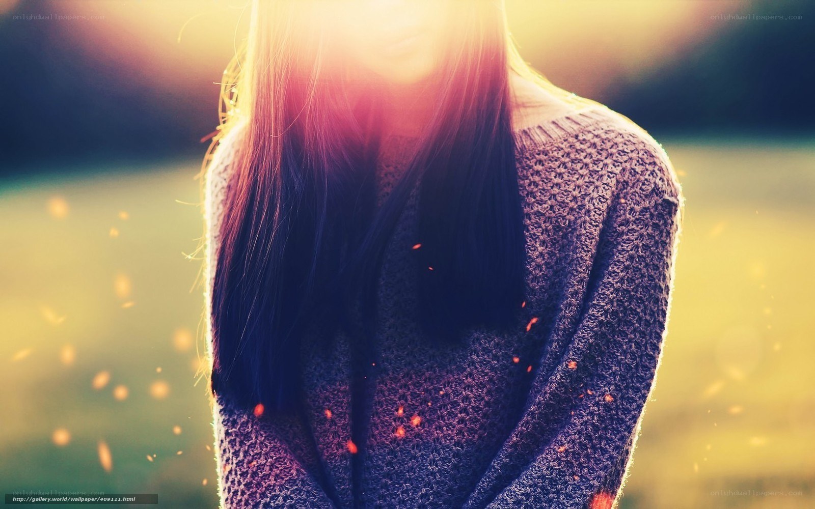 woman in sweater at sunset