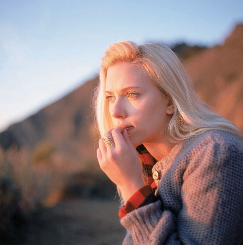 woman in sweater at sunset