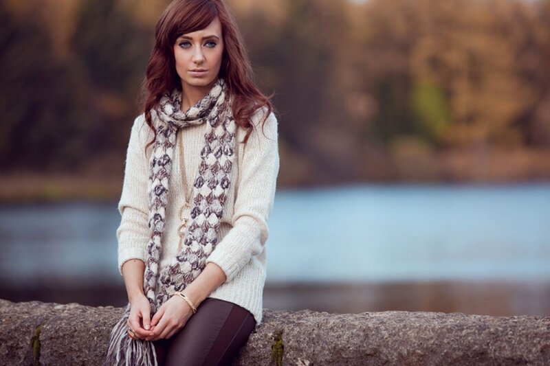 woman in sweater by water