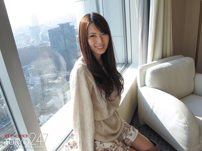 Woman in sweater by window