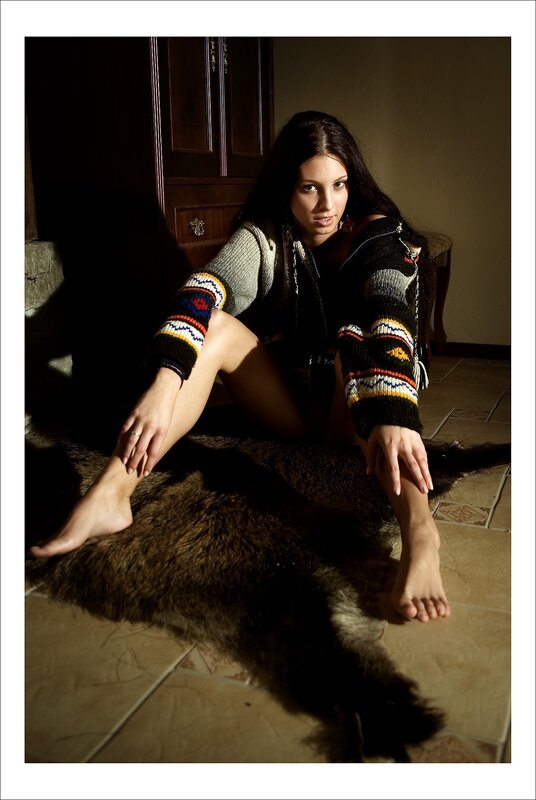 woman in sweater on rug