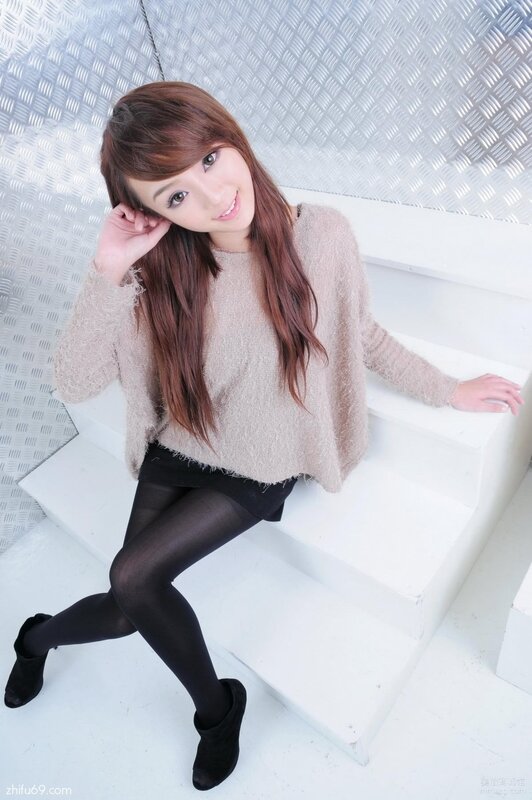 woman in sweater on stairs