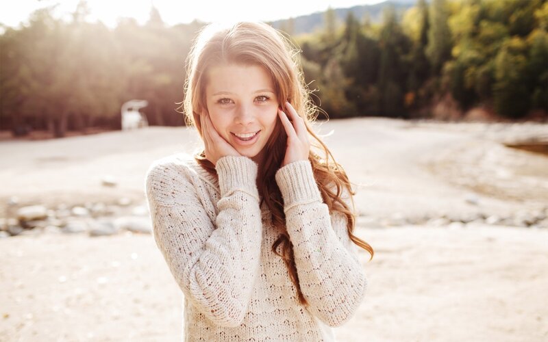 woman in sweater outdoors