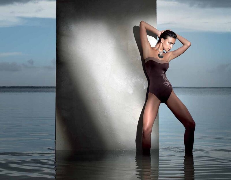 woman in swimsuit by water