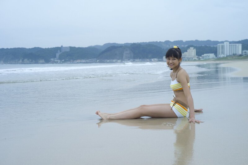 Woman in swimsuit on beach