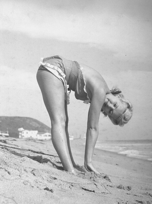 Woman in swimsuit on beach