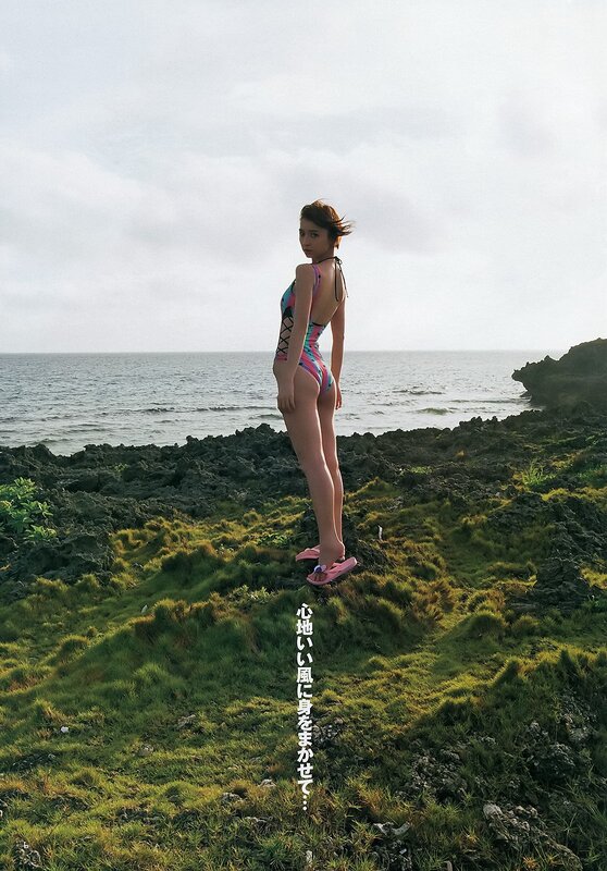 Woman in Swimsuit on Cliff