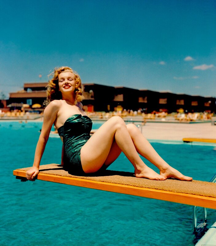 Woman in swimsuit on diving board