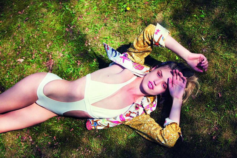 Woman in swimsuit on grass