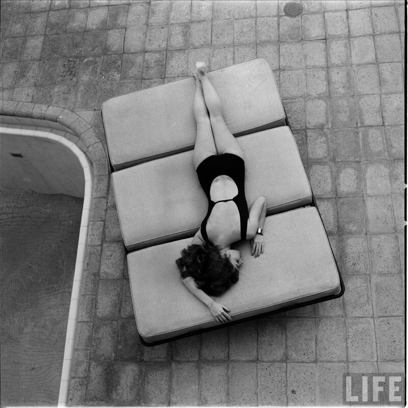 Woman in swimsuit on lounge chair