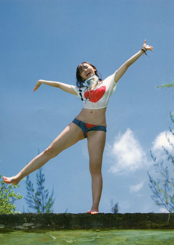 woman in swimwear on ledge