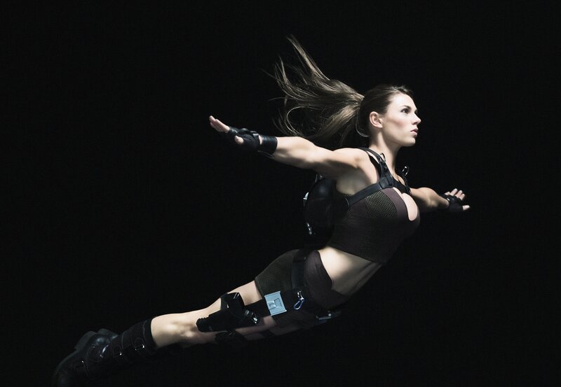 woman in tactical gear mid-air
