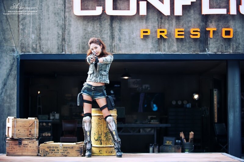 woman in tactical gear with gun