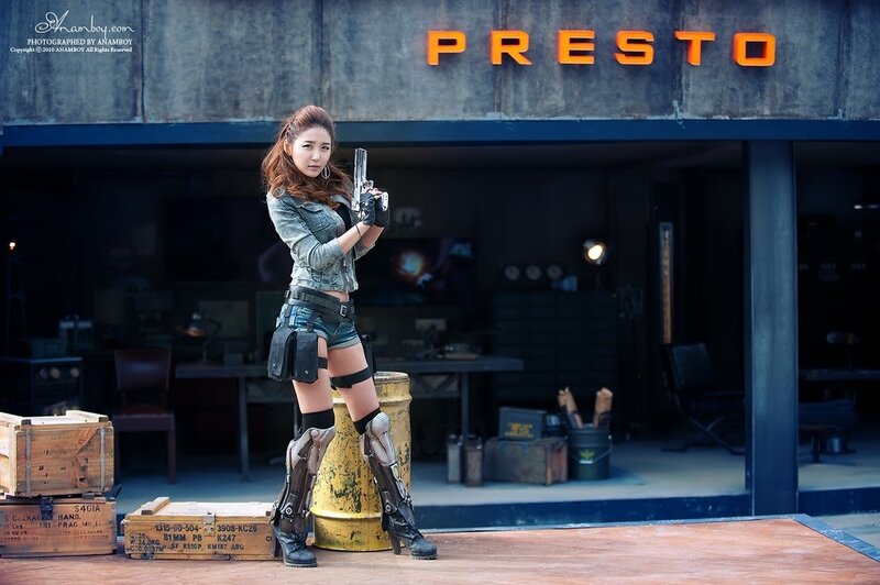 woman in tactical gear with gun
