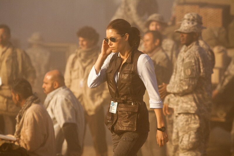 Woman in tactical vest walking
