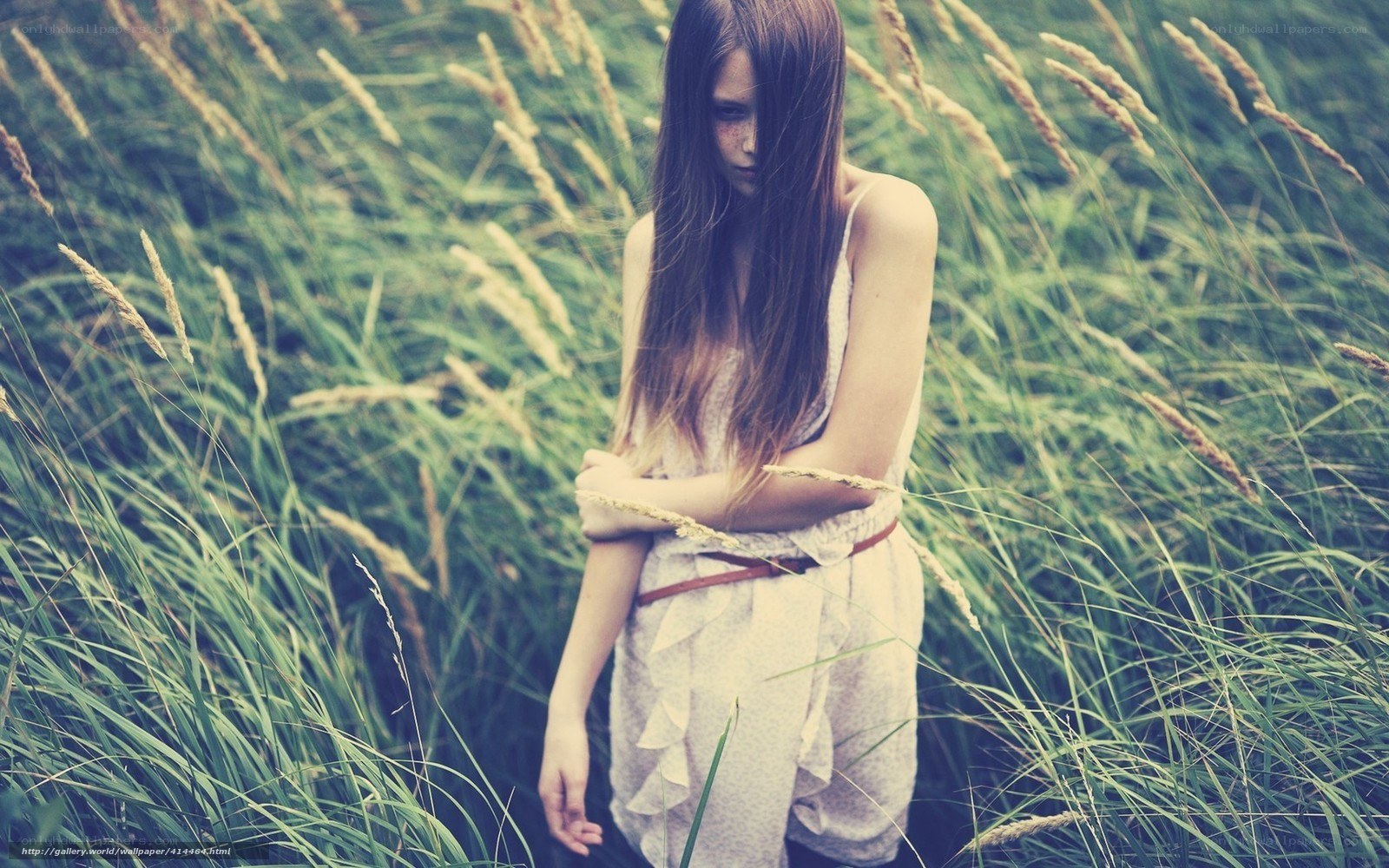 woman in tall grass