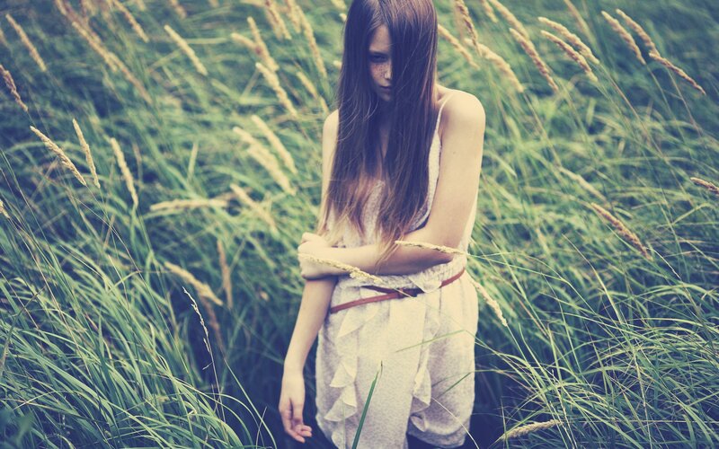 woman in tall grass