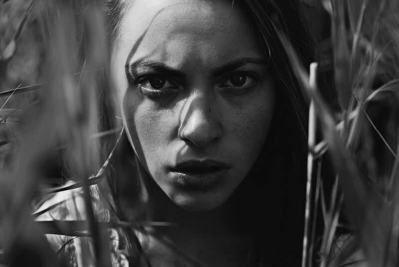 woman in tall grass
