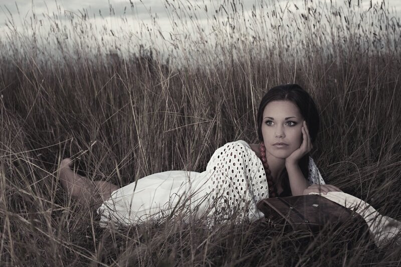 Woman in Tall Grass — Brown, Contemplative