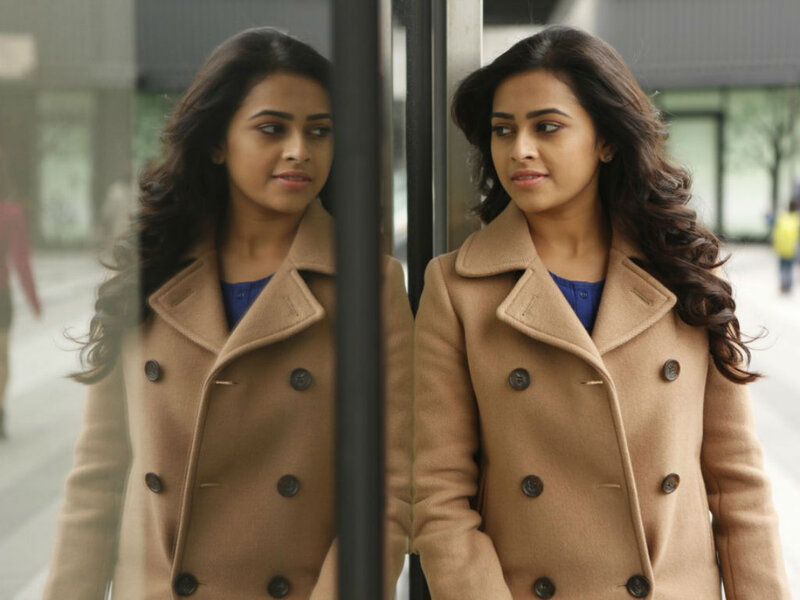 Woman in Tan Coat — Contemplative