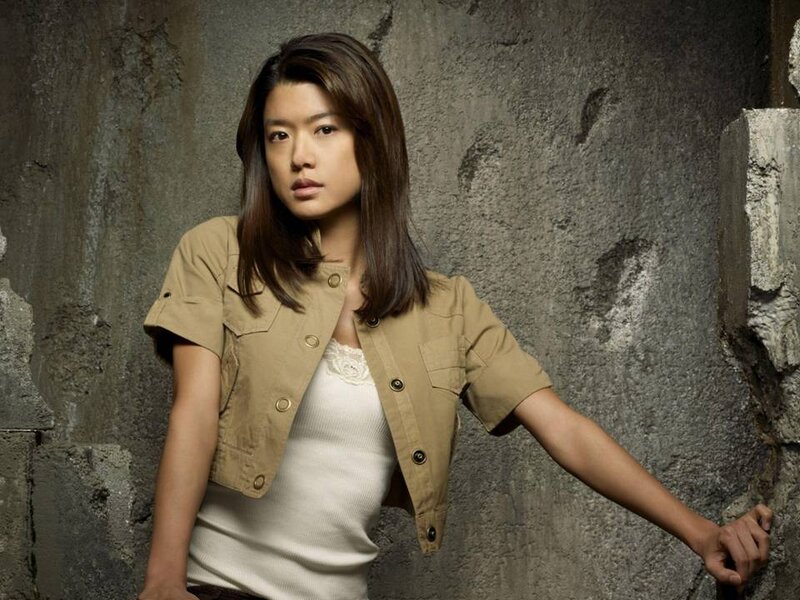 Woman in Tan Jacket — Brown