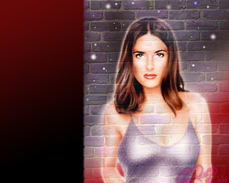 woman in tank top against brick wall