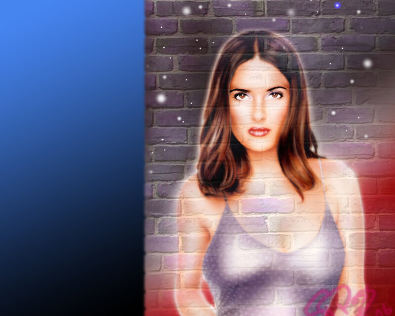 woman in tank top against brick wall