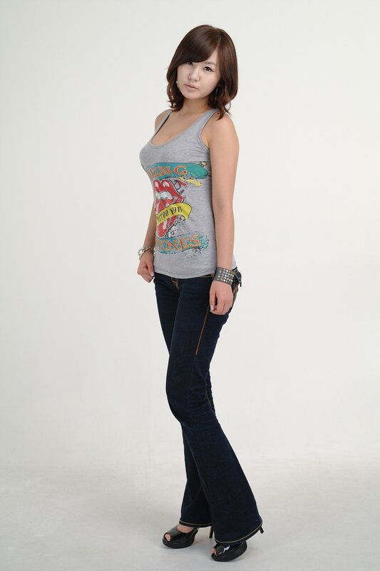 Woman in Tank Top — Gray, Neutral, Photograph, Jeans