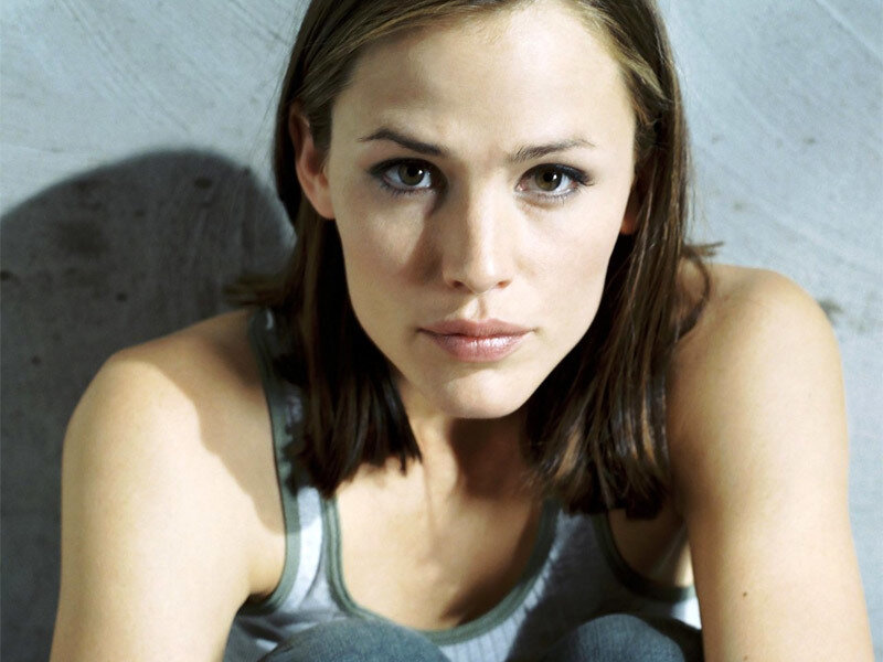 woman in tank top looking at camera
