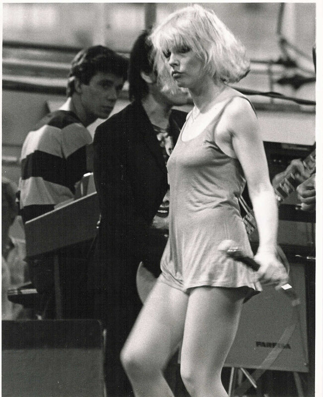 Woman in tank top on stage